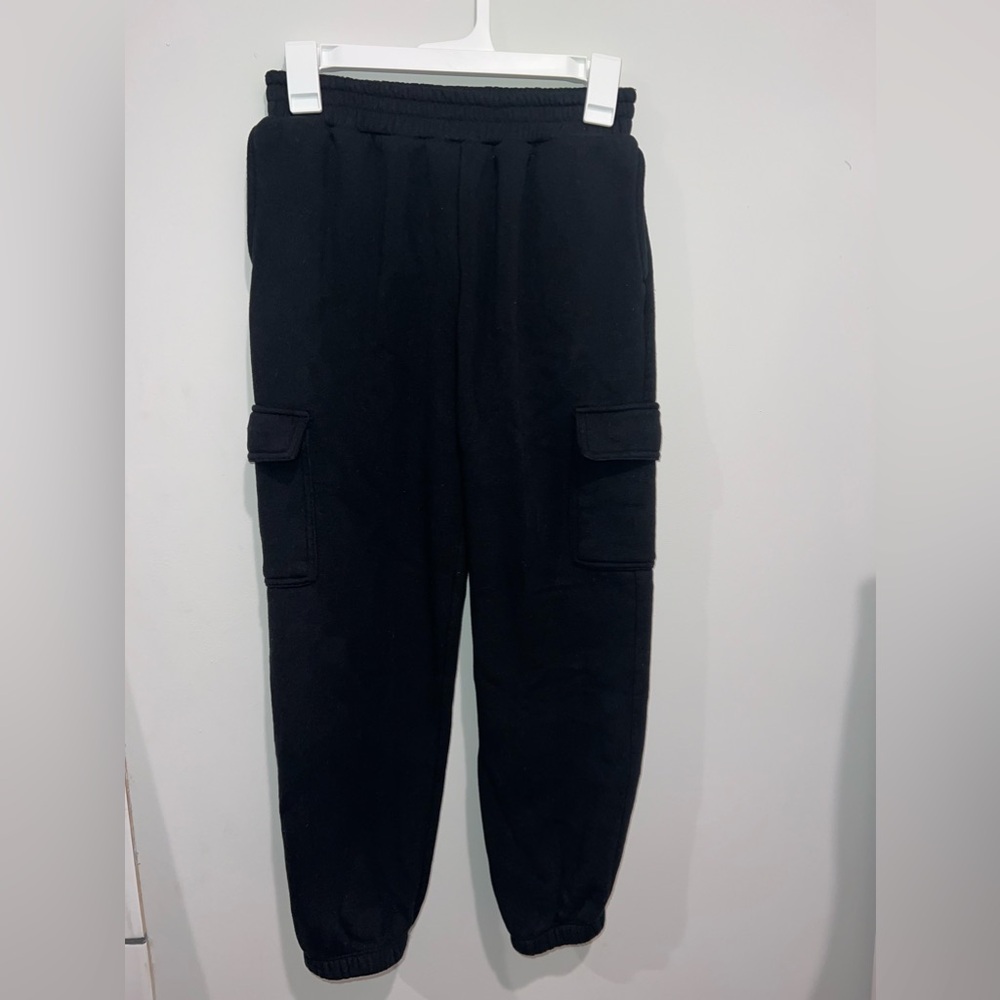 Plain black sweatpants joggers. No specific brand. So soft and fleece inside.